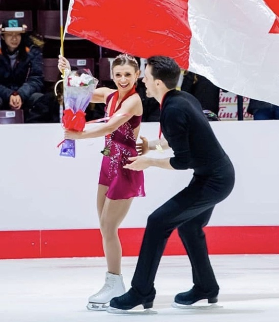 pair team on the ice celebrating pair team on the ice celebrating