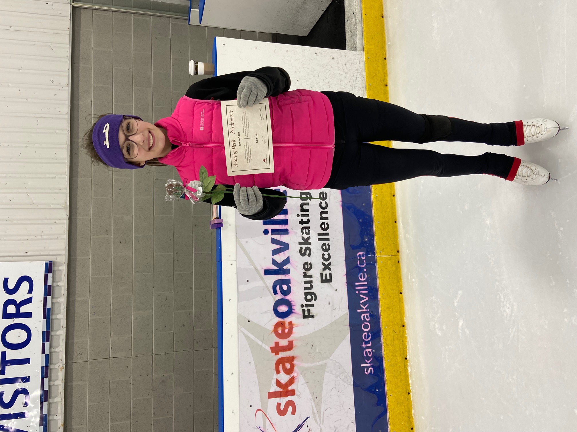 figure skater displaying her test she has just passed